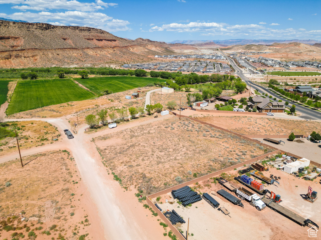 Birds eye view of property with a mountain view