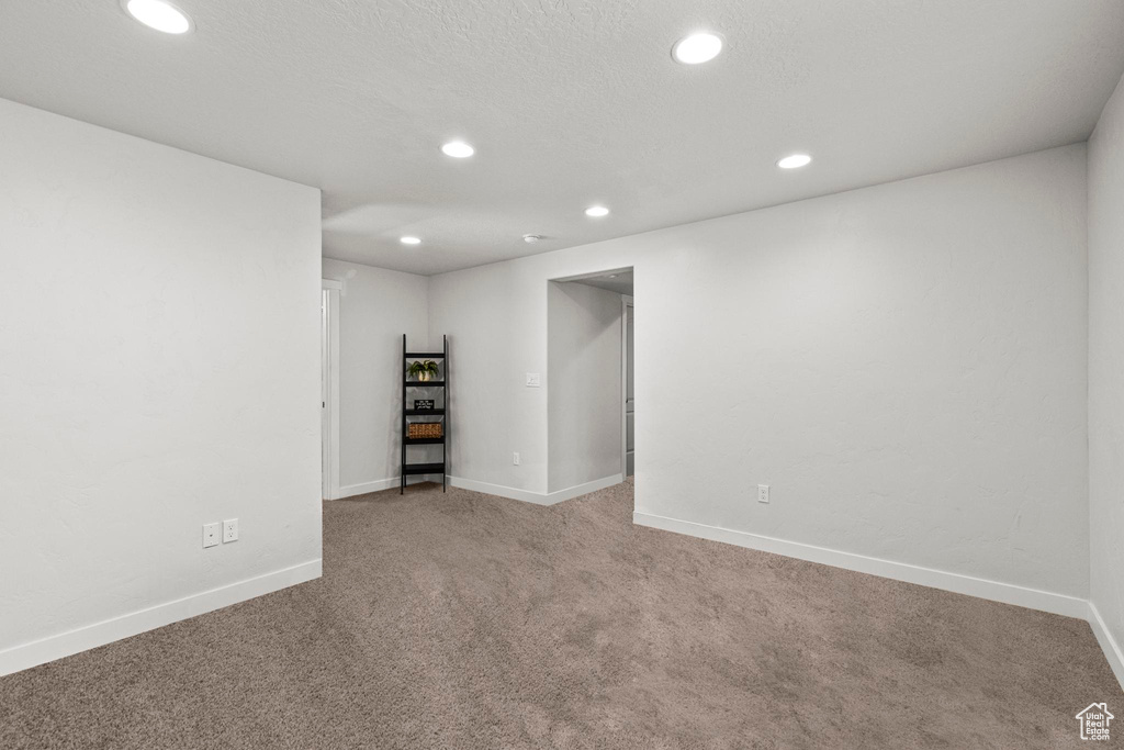 Basement with recessed lighting, carpet, and baseboards