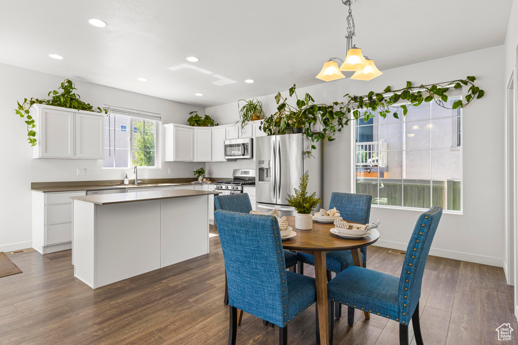 Dining room featuring recessed lighting, baseboards, and dark wood-style floors