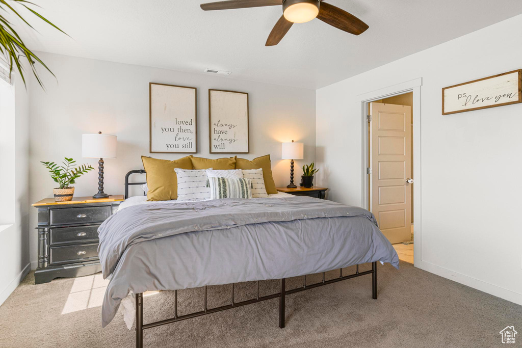 Bedroom featuring baseboards, ceiling fan, carpet flooring, and visible vents