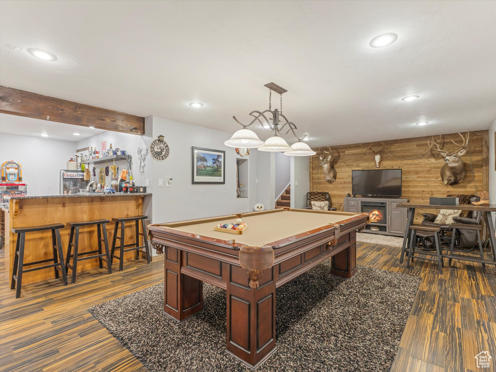Recreation room featuring recessed lighting, pool table, a bar, and dark wood-type flooring