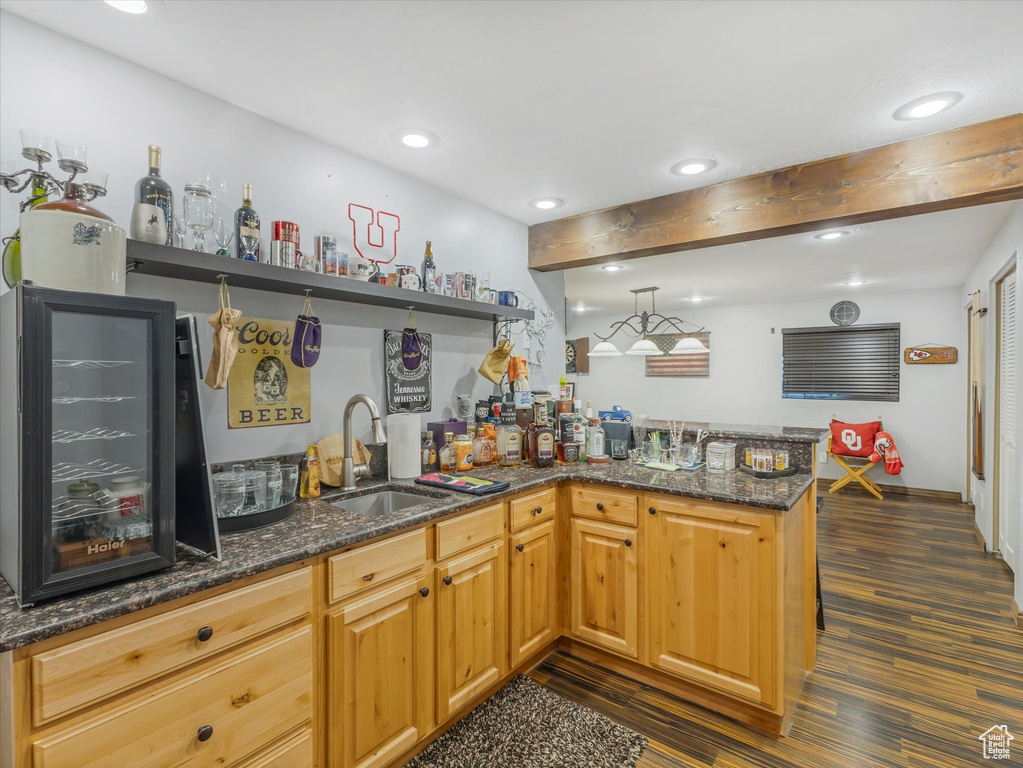 Bar with beamed ceiling, indoor wet bar, recessed lighting, a sink, and dark wood finished floors