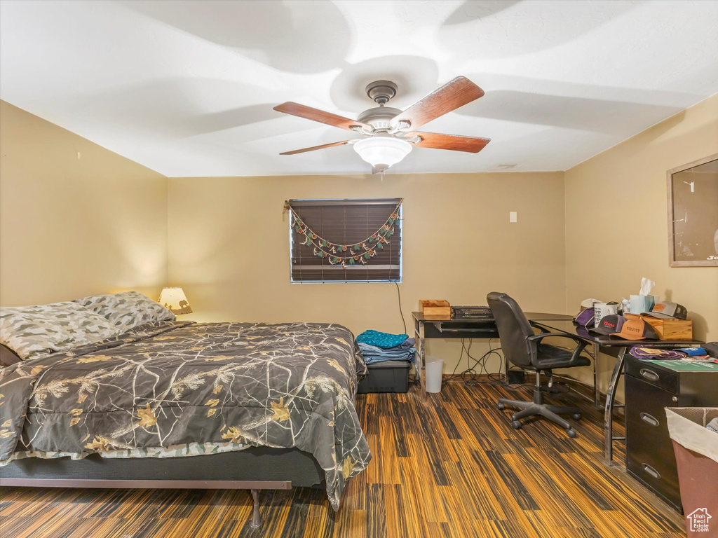 Bedroom with a ceiling fan and wood finished floors