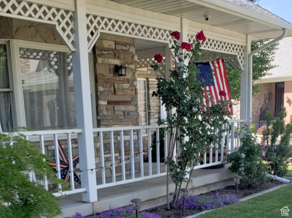 View of yard with covered porch
