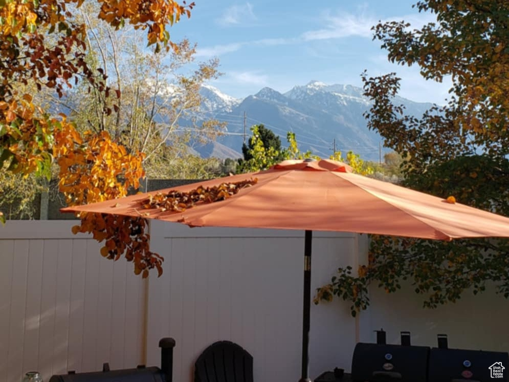 View of patio / terrace featuring outdoor dining area and a mountain view