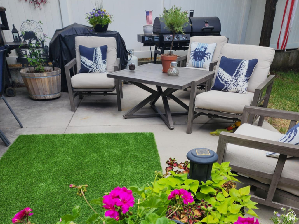 View of yard with an outdoor living space and a patio area