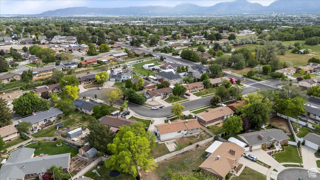 Aerial view of residential area featuring a mountain backdrop