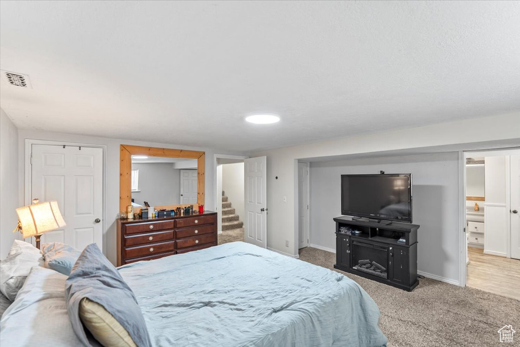 Carpeted bedroom featuring baseboards