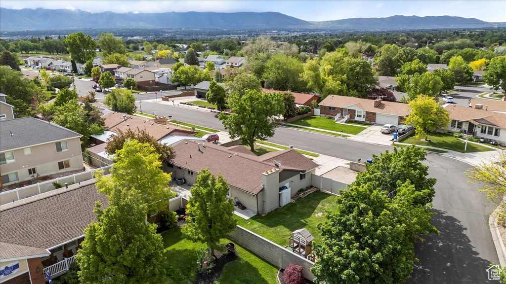 Aerial view of residential area featuring a mountain backdrop