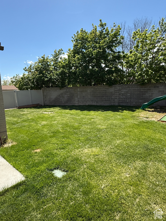 View of yard featuring a fenced backyard