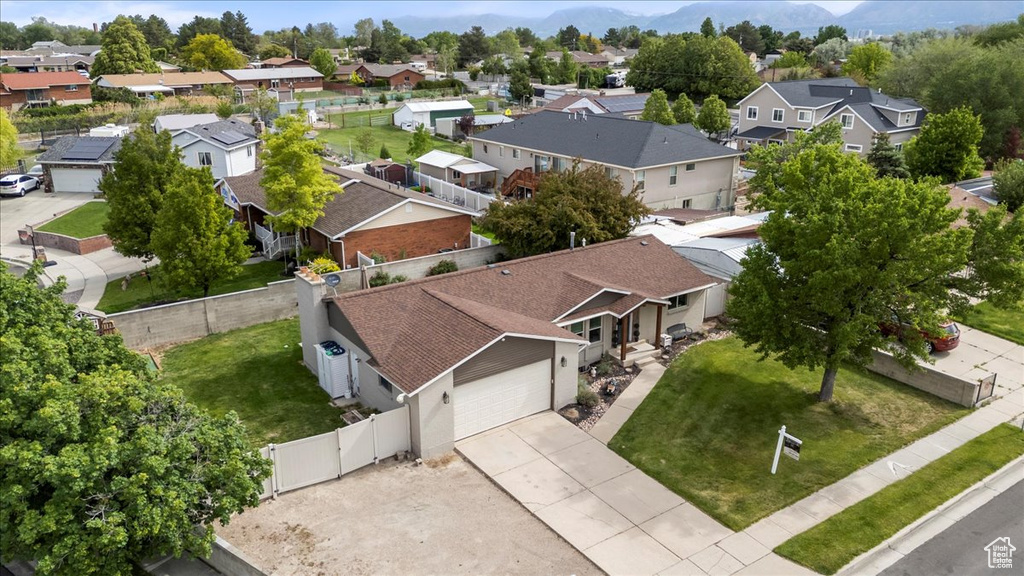 Aerial view of residential area featuring mountains