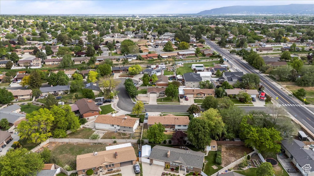 Aerial view of residential area featuring a mountainous background