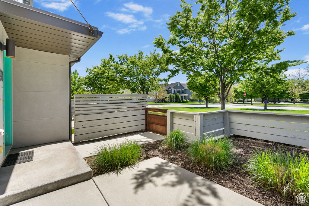 View of yard with fence and a gate