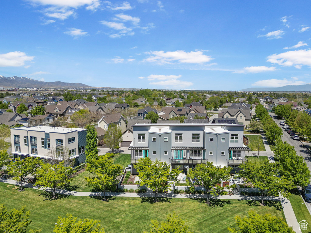 Birds eye view of property with a residential view and a mountain view