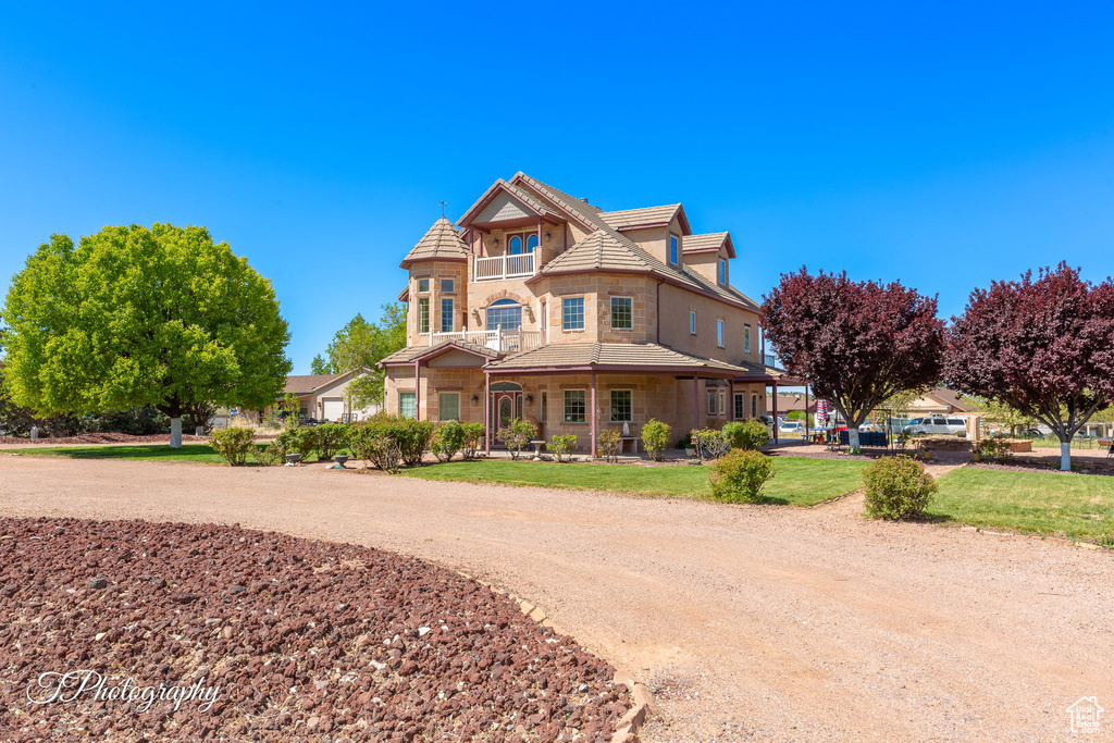 Victorian house with a tiled roof and stone siding