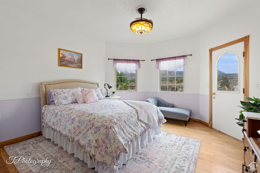 Bedroom featuring baseboards and light wood-type flooring