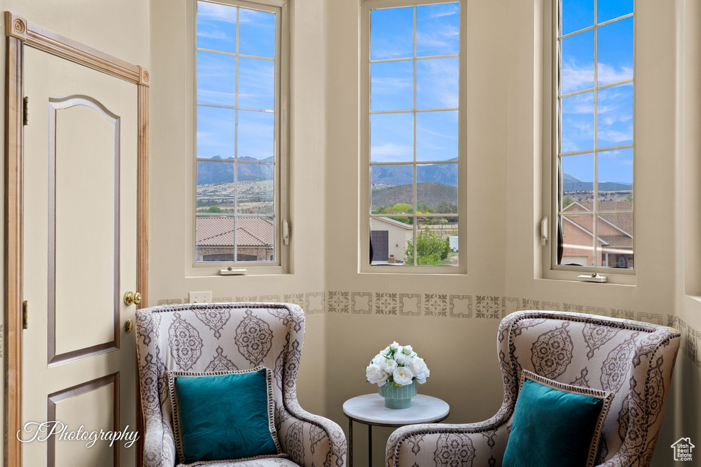 Living area with a mountain view and a healthy amount of sunlight