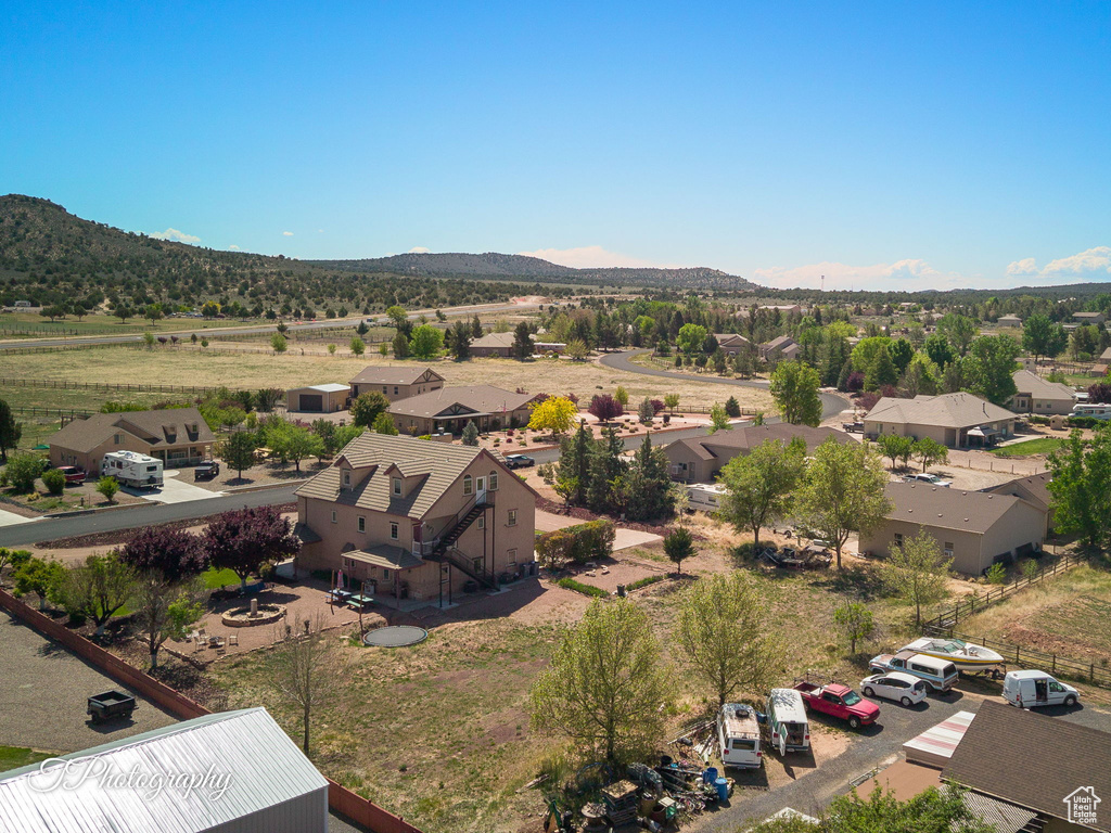Birds eye view of property with a residential view and a mountain view