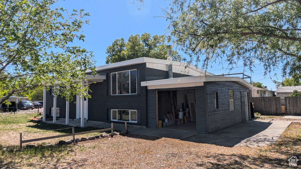 Back of house featuring fence