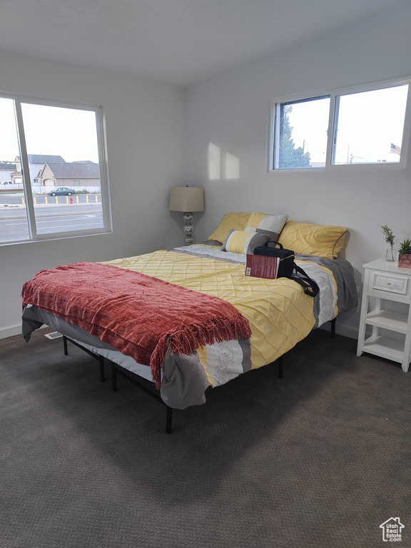 Carpeted bedroom with baseboards