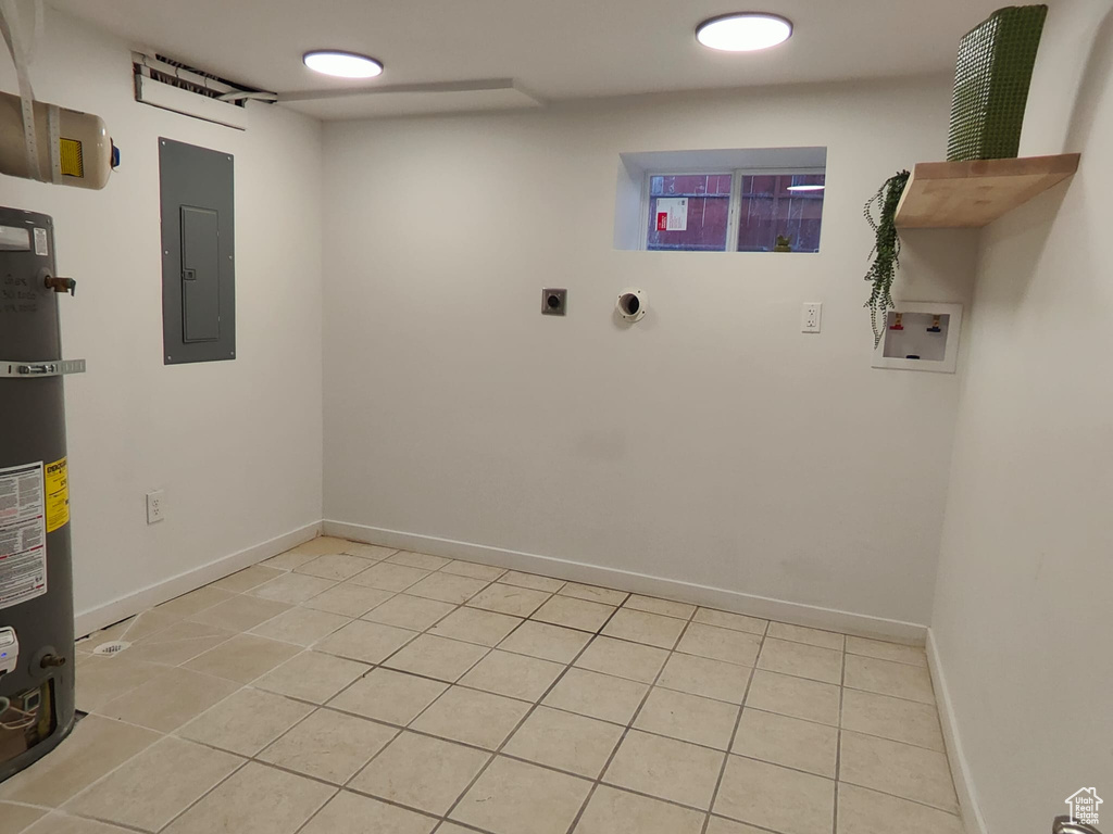 Laundry room featuring electric panel, hookup for a washing machine, electric dryer hookup, and baseboards