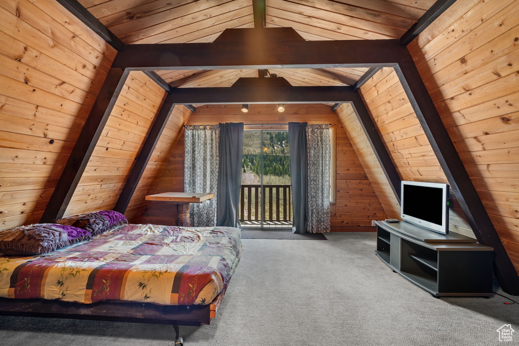 Carpeted bedroom with wooden walls, wooden ceiling, and vaulted ceiling with beams