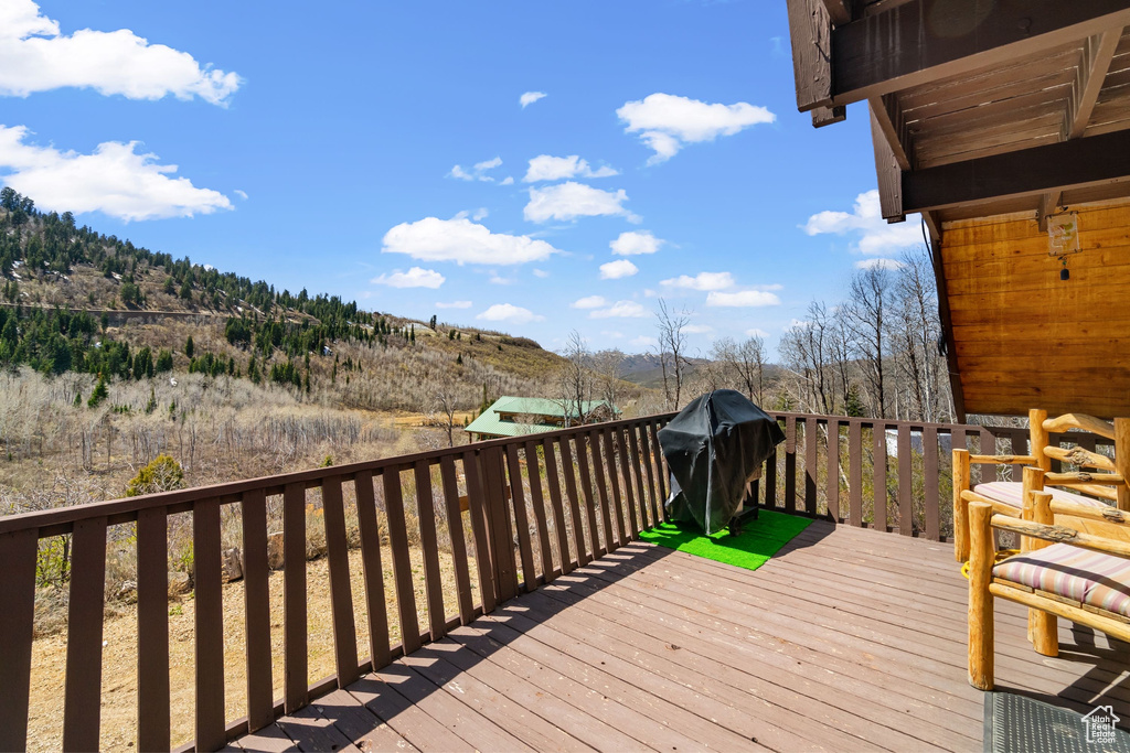 Deck with grilling area and a mountain view