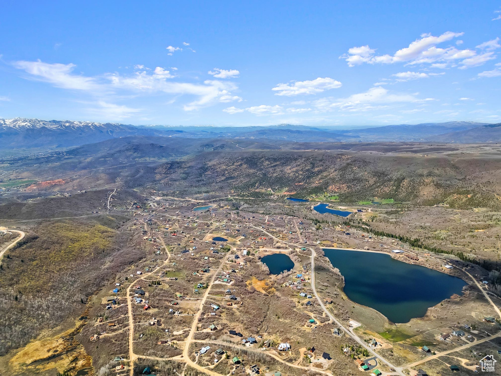Bird's eye view with a water and mountain view