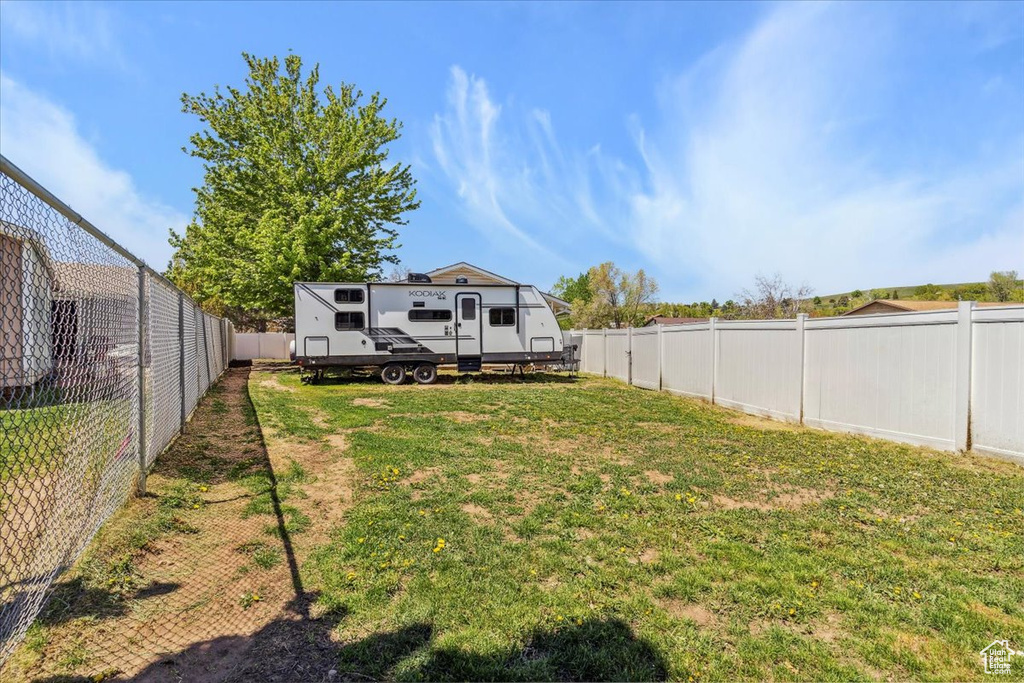 View of yard with a fenced backyard
