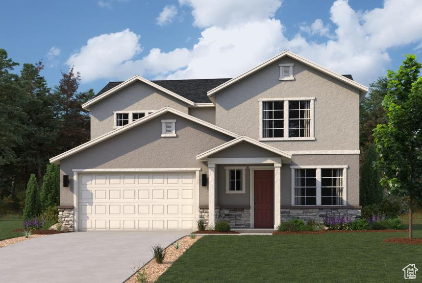 Traditional home featuring stone siding, a garage, stucco siding, a front yard, and concrete driveway