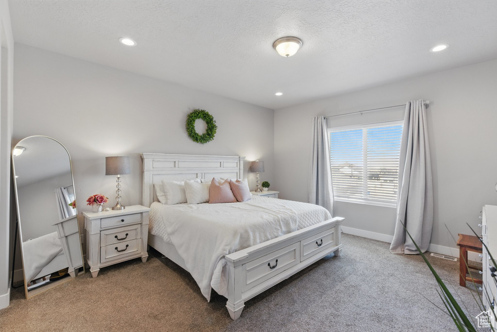 Bedroom with recessed lighting, baseboards, and light colored carpet