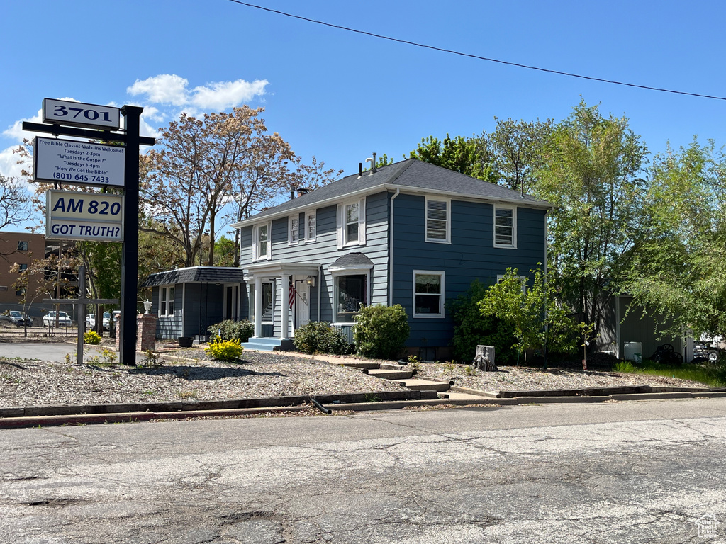 Colonial-style house featuring a chimney