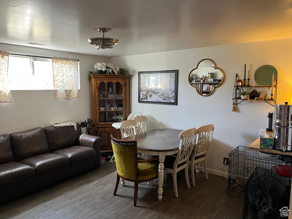 Dining space featuring wood finished floors and visible vents