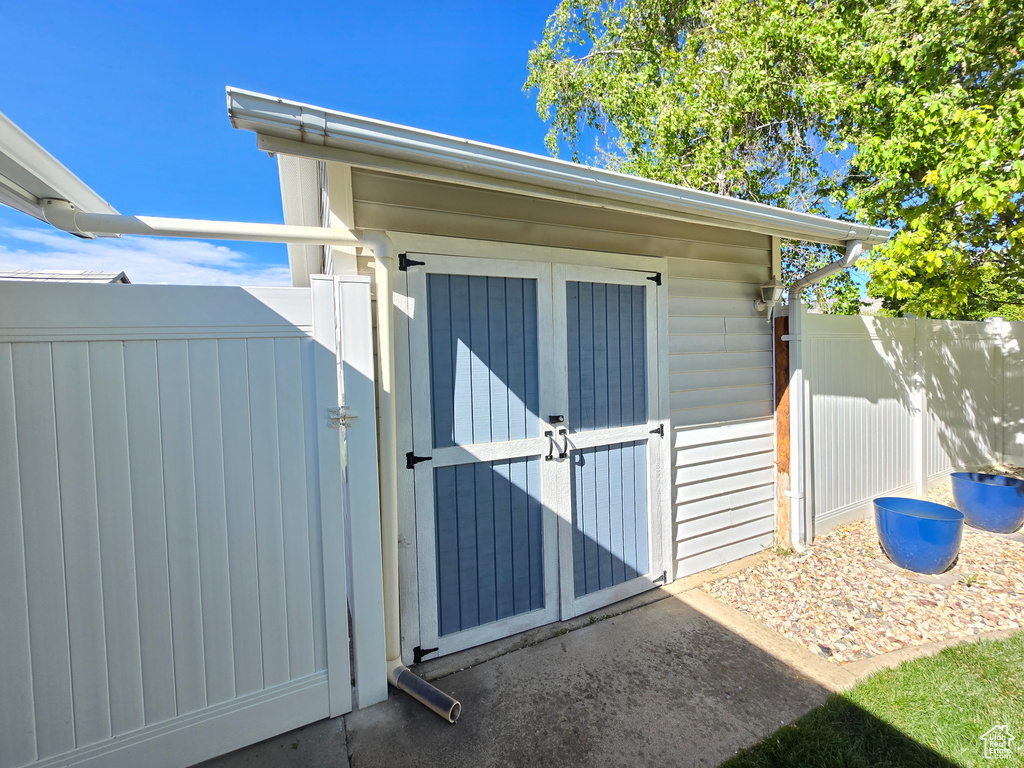 View of shed with fence