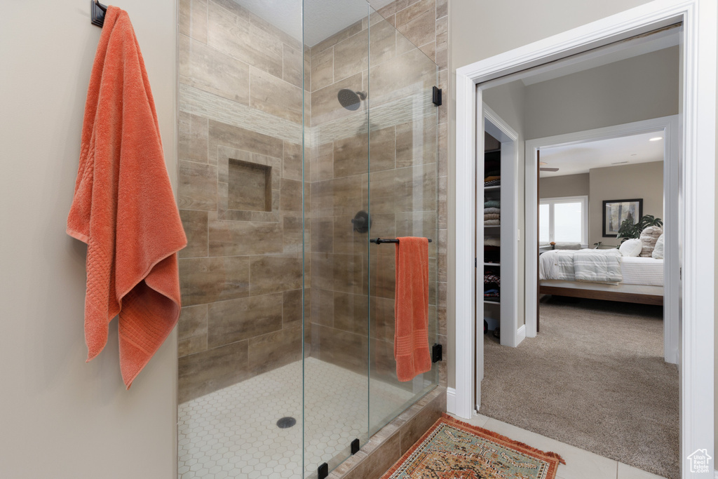 Bathroom with a shower with shower door