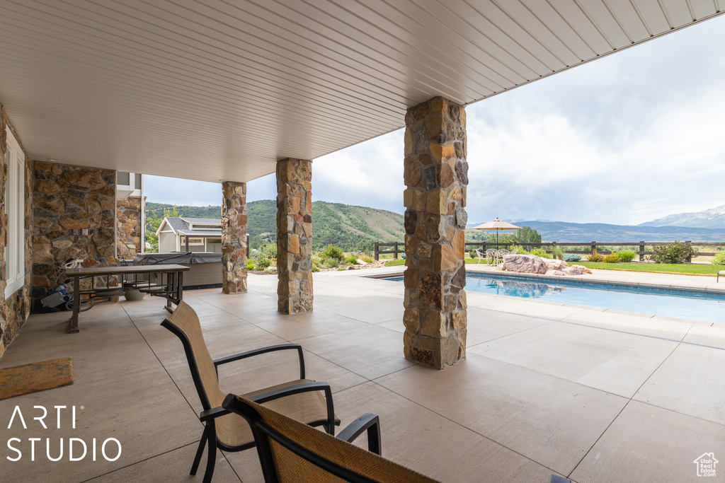 View of patio / terrace featuring a mountain view