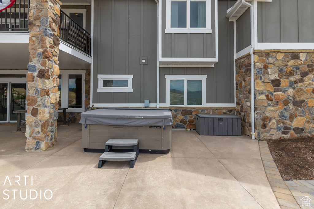 View of patio featuring a hot tub