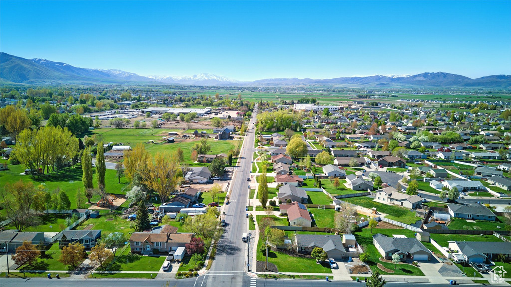 Birds eye view of property with a residential view and a mountain view