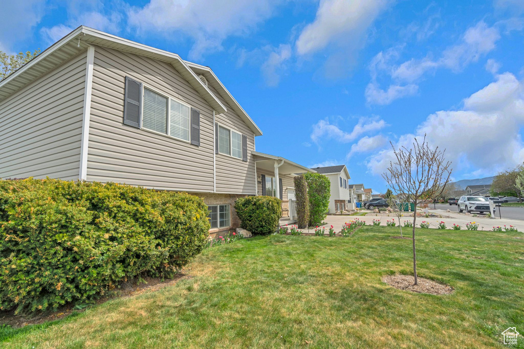Exterior space featuring a lawn