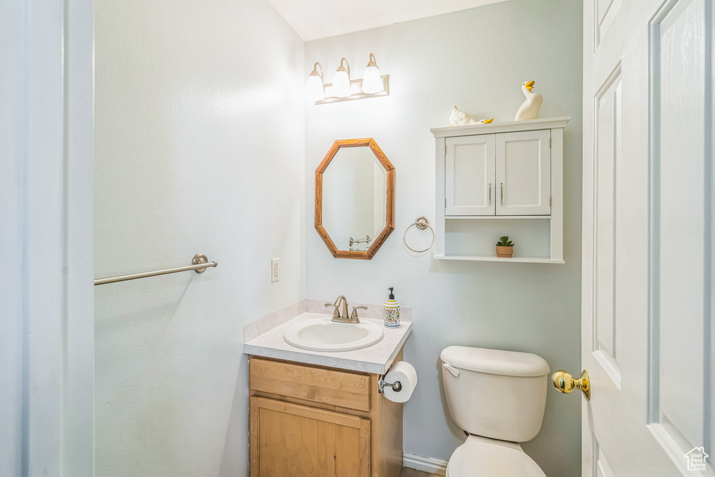 Bathroom with toilet and vanity