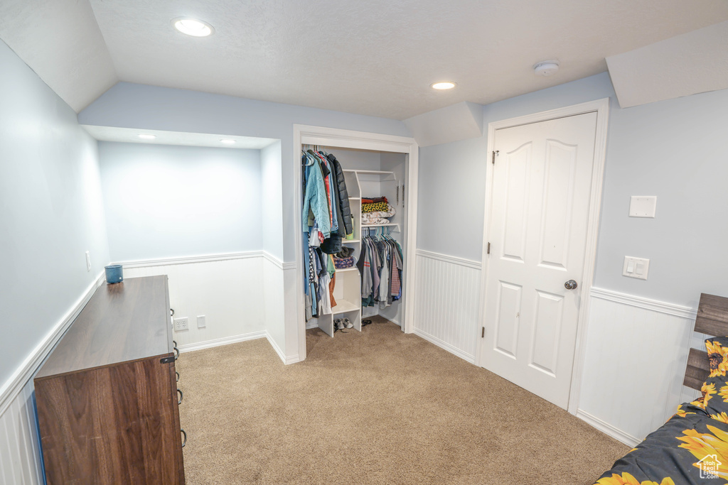 Bedroom featuring a closet, recessed lighting, and carpet