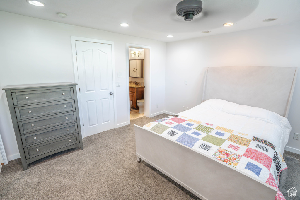 Bedroom featuring carpet floors, ensuite bathroom, and recessed lighting
