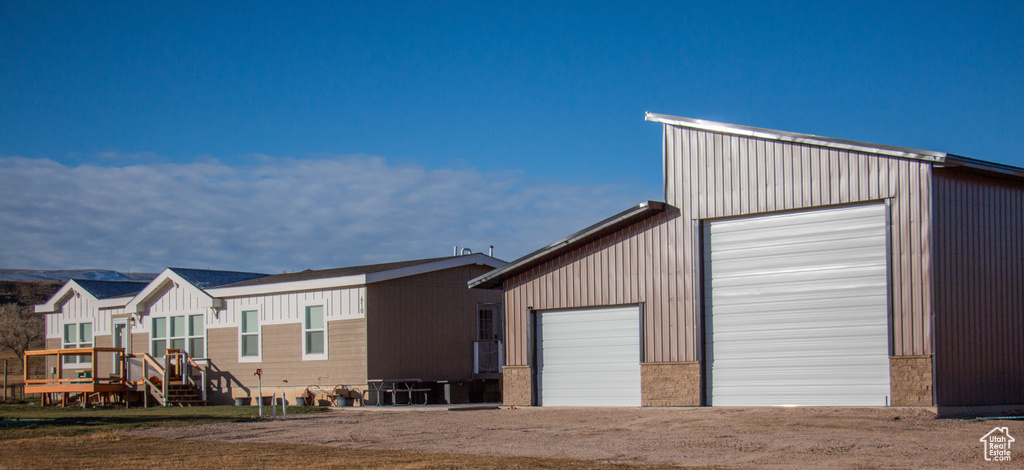 Exterior space featuring a deck and an outdoor structure
