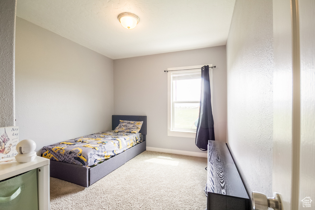 Bedroom with carpet and baseboards