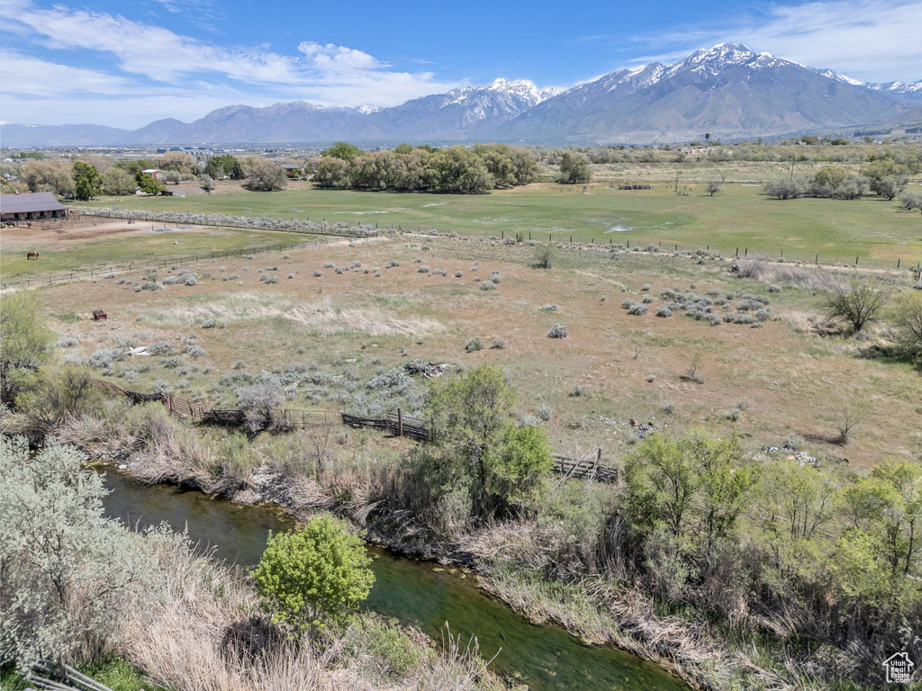 Property view of mountains with a rural view