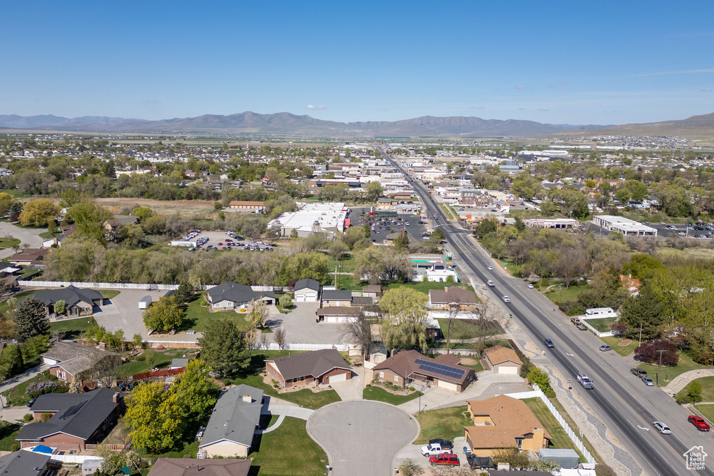 Birds eye view of property with a mountain view and a residential view