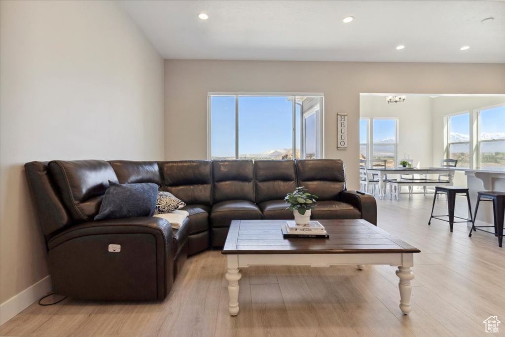 Living area with recessed lighting and light wood-style floors