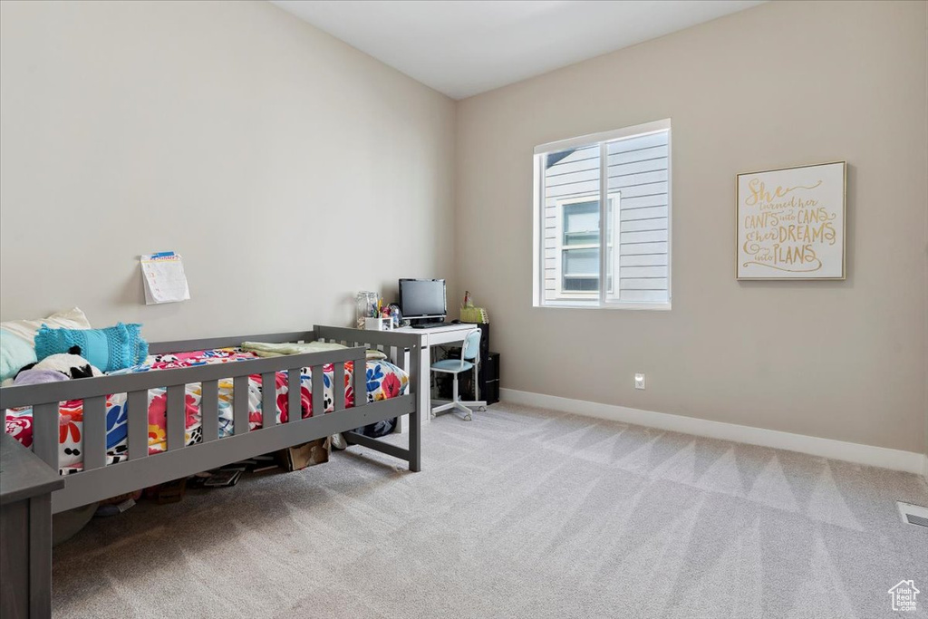 Bedroom featuring baseboards, carpet flooring, and visible vents