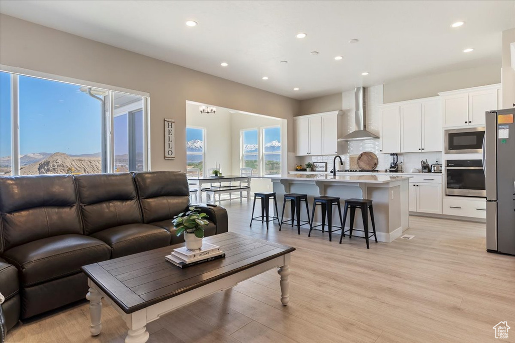 Living room featuring recessed lighting and light wood-style floors