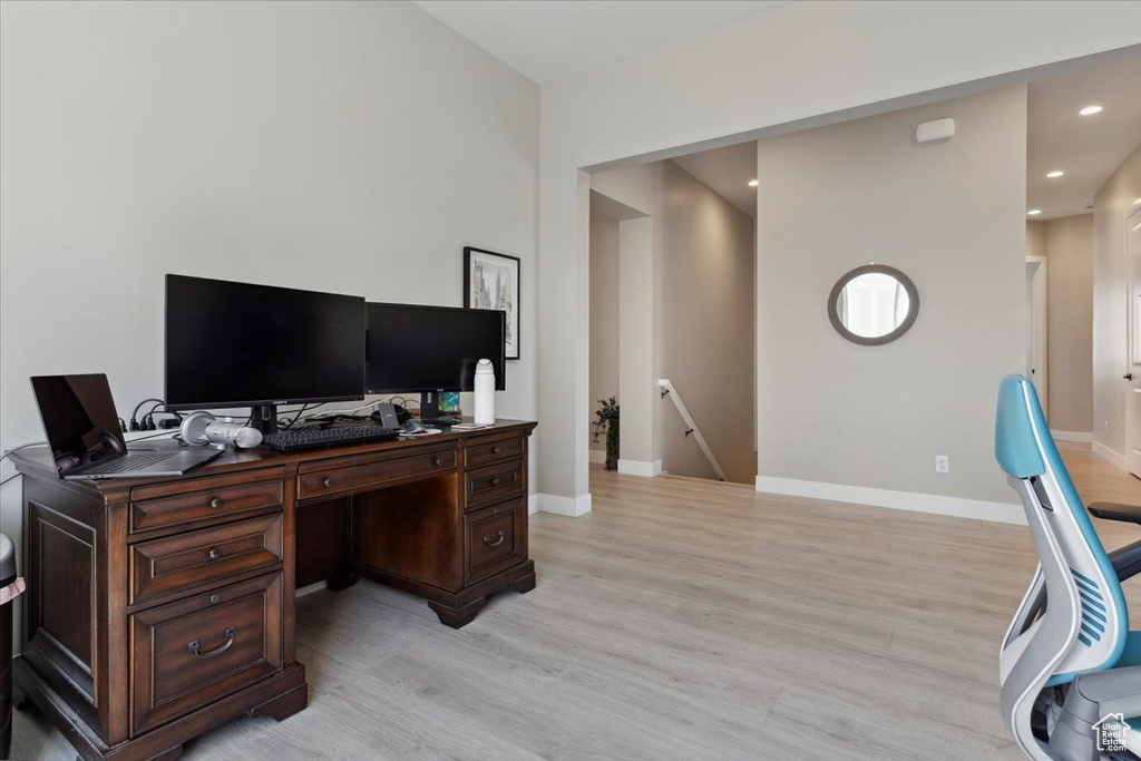 Office featuring baseboards, recessed lighting, and light wood-type flooring